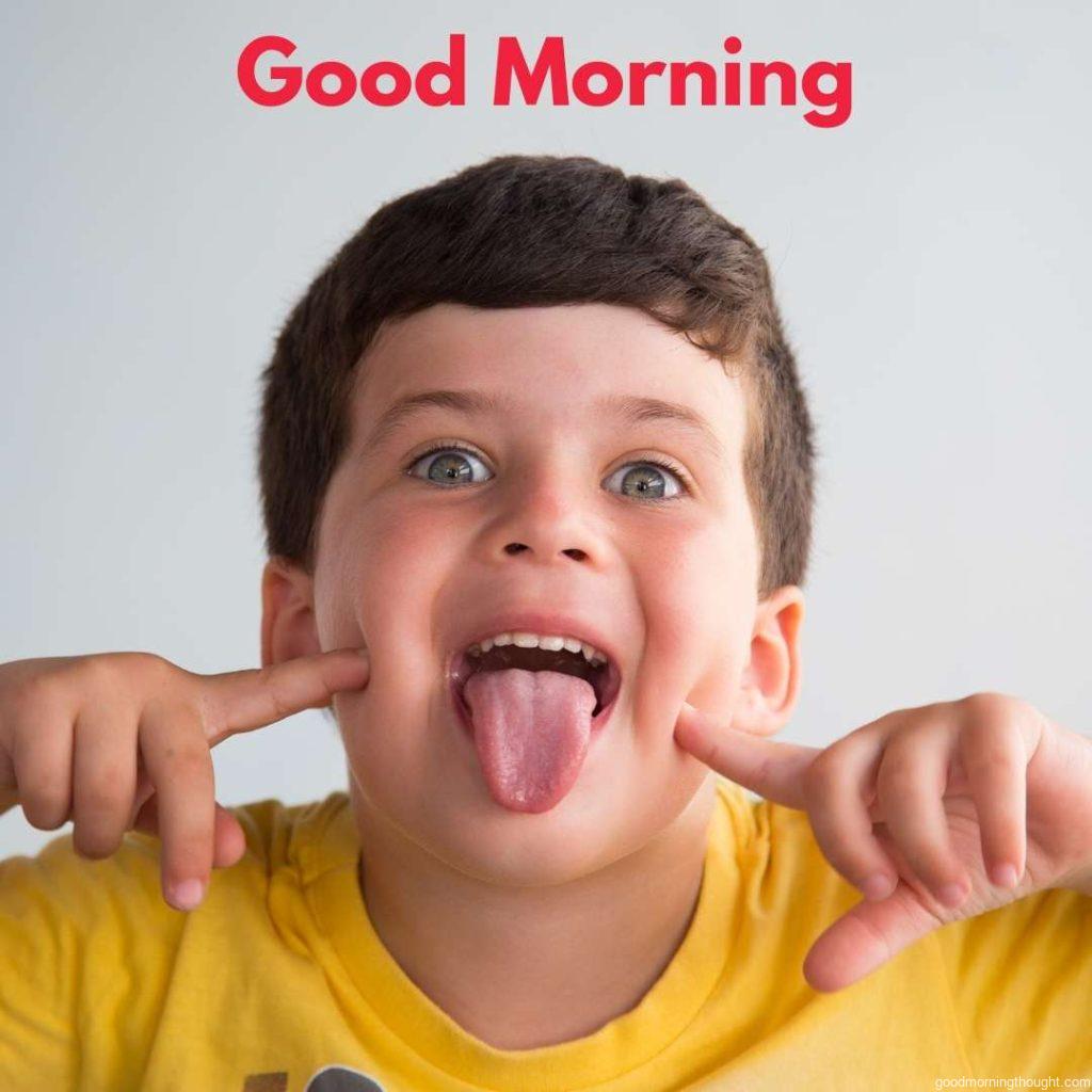 Little kid sticking out his tongue. Happy Good Morning Images