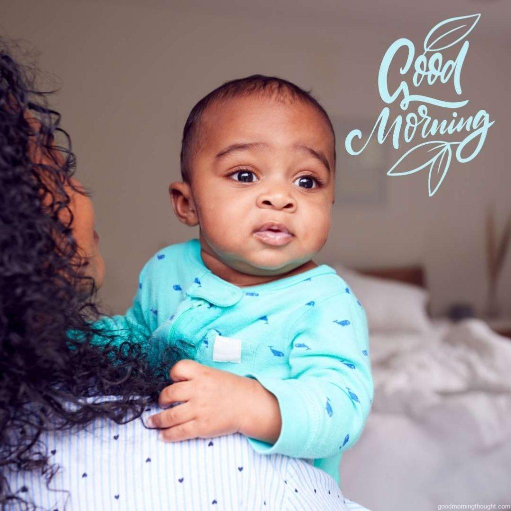 Loving African American Mother Wearing Pyjamas Cuddling Baby Daughter In Bedroom At Home, African American Good Morning Images