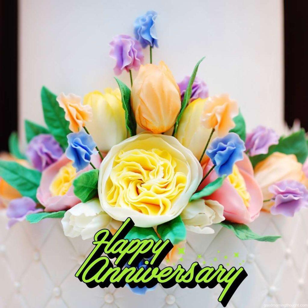 Part of a white wedding or birthday cake decorated with colourful cream flowers, Happy Wedding Anniversary Images