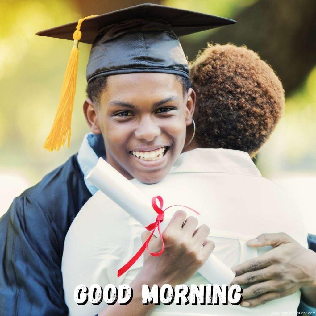 Smiling handsome An African American high school graduate hugs his mom or female relative after graduating from high school