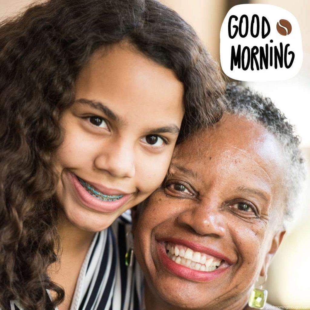 a smiling African American woman posing with her granddaughter, Good Morning Text