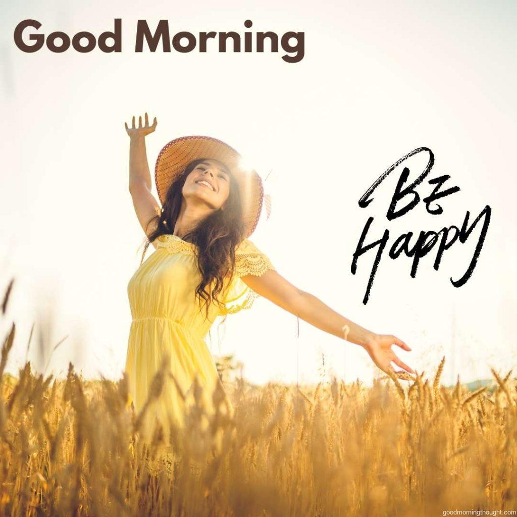 happy young woman with open arms in the wheat field on a sunny day. _Good Morning_ text. Happy Good Morning Images